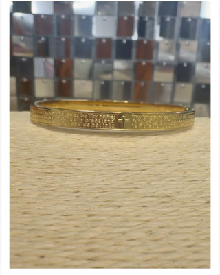 Gold polished bangle bracelet engraved with Lord's Prayer and cross motif
