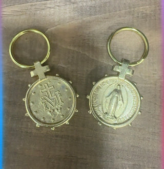 Gold-tone Miraculous Medal keychain showing both sides with Virgin Mary and cross