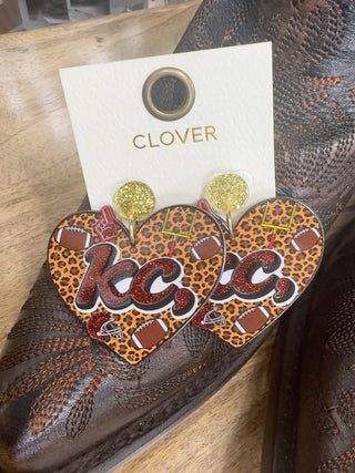 Heart-shaped KC football leopard print dangle earrings with gold glitter studs