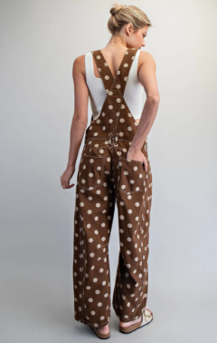 Brown polka dot wide-leg overalls with white tank top, back view