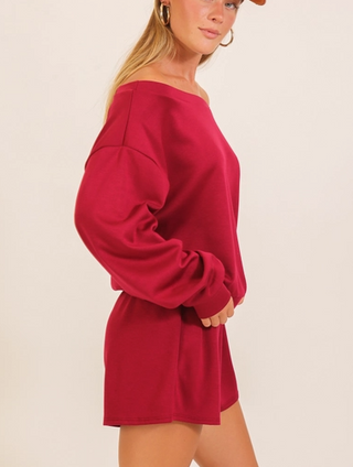 Magenta off-shoulder oversized sweatshirt romper with balloon sleeves and relaxed fit