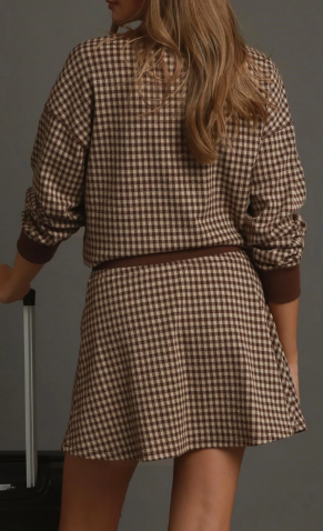 Brown plaid two-piece set with long sleeve top and flared mini skirt